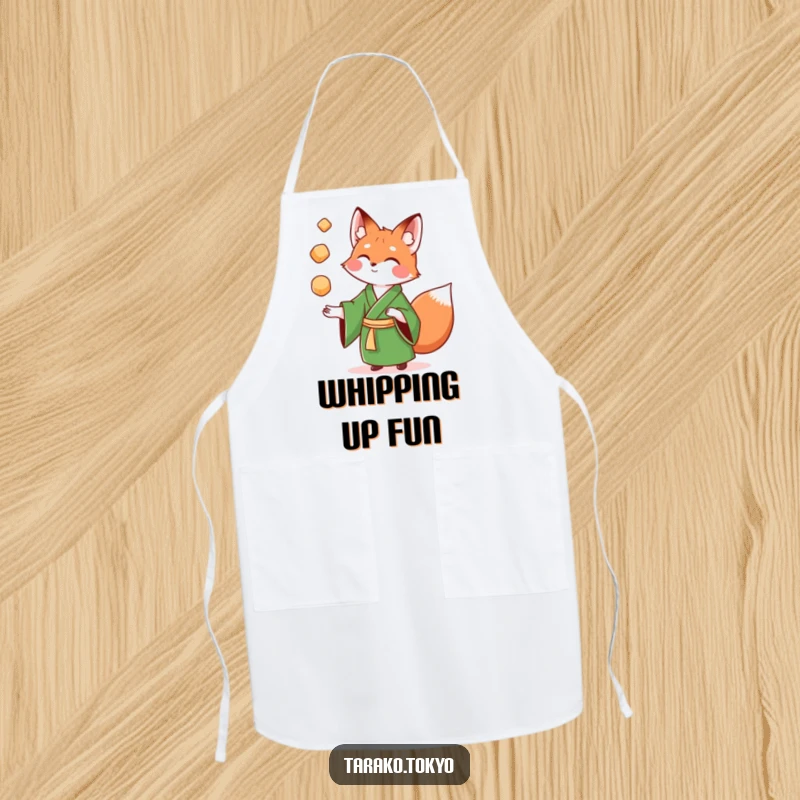 Funny Apron with a playful fox in a green kimono juggling colorful mochi, perfect for cooking and baking.